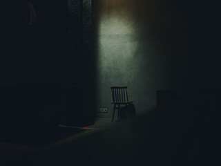 one chair stands in the middle of a dark room silhouette of a falling light interior