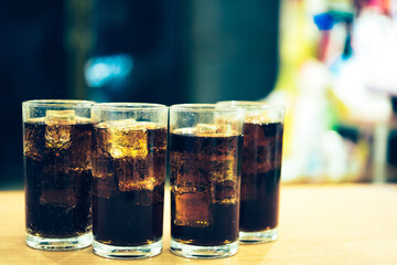 Refreshing Bubbly Soda Pop with Ice Cubes. Cold soda iced drink in a glasses - Selective focus, shallow DOF