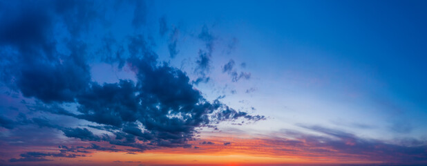 Naklejka na ściany i meble Dramatic sunset or sunrise sky. Natural sky background from panoramic view.