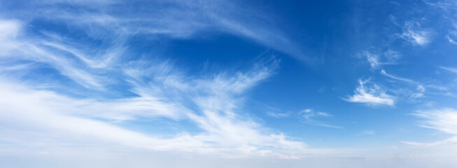 Blue sky background with white clouds at daylight.