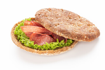 Sandwich with salami sausage on white background.