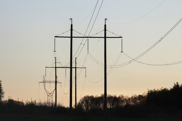 Fototapeta na wymiar High-voltage power line at sunset.