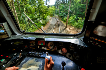 Interior view of the pilot hands and instrument panel cockpit of ancient train