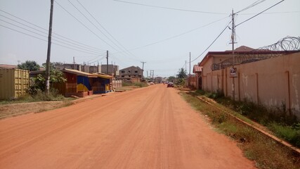 Sandy road somewhere in the city of Accra, Ghana.