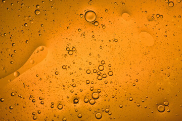 orange liquid background of bubbles with movement