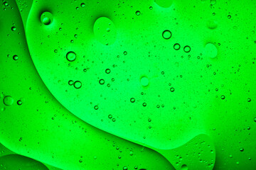 loose green liquid background of bubbles with movement