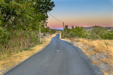 Sunrise over road in Causse Blandas