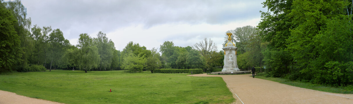 Panoramic view of Berlin Tiergarten community park with memorial statue depicting composers Mozart, Beethoven and Haydn