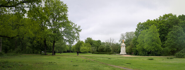 Panoramic view of Berlin Tiergarten community park with memorial statue depicting composers Mozart,...