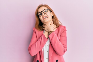 Young caucasian woman wearing business style and glasses shouting suffocate because painful strangle. health problem. asphyxiate and suicide concept.