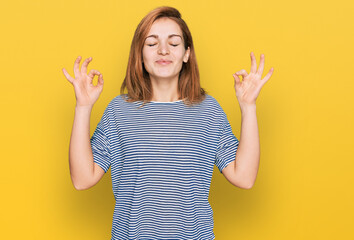 Young caucasian woman wearing casual clothes relax and smiling with eyes closed doing meditation gesture with fingers. yoga concept.