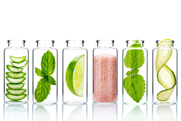 Alternative skin care and homemade scrubs with natural ingredients  in glass bottles isolate on white background.