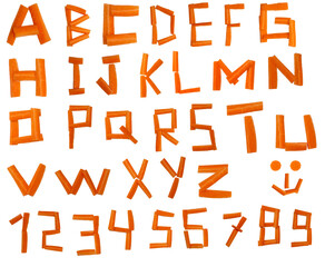 Letters made from vegetable sticks from carrots, arranged into alphabet and numbers