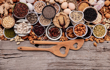 Ingredients for the healthy foods selection in ceramic bowl. The concept of superfoods set up on white shabby wooden background with copy space.