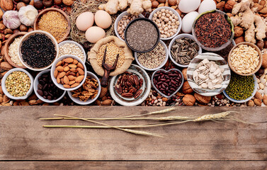 Ingredients for the healthy foods selection in ceramic bowl. The concept of superfoods set up on white shabby wooden background with copy space.