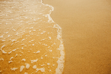 sand of the Caribbean beach, sand close-up against the background of the sea and the ocean, clean fine hot beach sand blown by the sea wind, no people, weather for tourists, place to stay