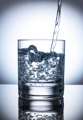 Pouring water in glass. glass with water and air water bubbles,world water day,save water,