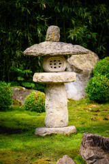 Fototapeta na wymiar Japanese stone lamp decoration in the park.