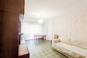 Russia, Moscow- April 28, 2020: interior room apartment bright cozy atmosphere. general cleaning, home decoration, preparation of house for sale. living room with sofa. lamp chandelier on the ceiling