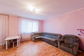 Naklejka na ściany i meble Russia, Moscow- April 28, 2020: interior room apartment bright cozy atmosphere. general cleaning, home decoration, preparation of house for sale. living room with sofa. lamp chandelier on the ceiling