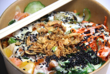 Plate of poke with salmon and vegetables