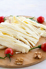 Cecil cheese on wooden background. Angel Hair Cheese, or stringy cheese.