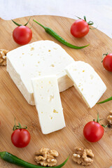 Ripe goat cheese on wooden background