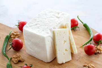 ripened cow cheese on wooden background