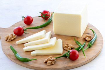 Cheddar cheese on a wooden background
