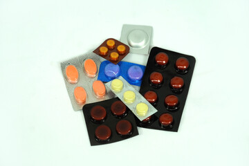 Colorful vitamin pills, capsules and medicine ampoules