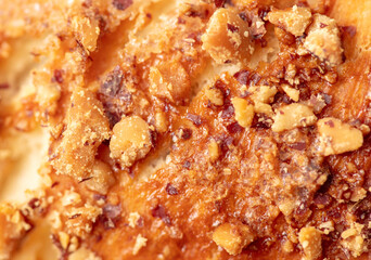 Ruddy crust on a sweet bun as a background.