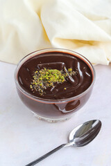 chocolate pudding on wooden background. Local name Supangle