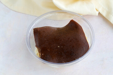 Milk dessert on wooden background. Local name kazandibi