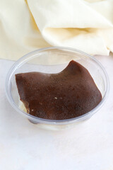 Milk dessert on wooden background. Local name kazandibi