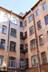 Fototapeta na wymiar walking in the downtown of Saint Petersburg - old dirty well yards