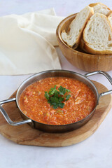 Tomato and peppered egg on wooden background. Local name menemen