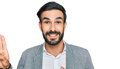Young hispanic man wearing business clothes smiling swearing with hand on chest and fingers up,...