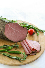 Roast beef on cutting board. Wooden background. local name kekikli roast beef