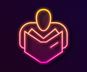 Glowing neon line Man reading book icon isolated on black background. Vector