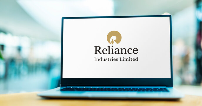 Laptop computer displaying logo of Reliance Industries