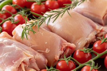 Raw boneless chicken thigh on a white wooden background. Chicken Meat background. Meat close-up