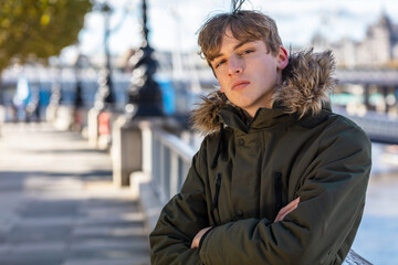 Boy Male Teenager With Attitude Outside Wearing Parka Coat © Darren Baker