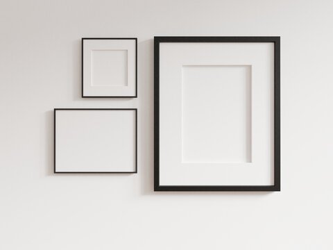 Empty photo frame hanging for mockup in empty white room. 3D rendering.