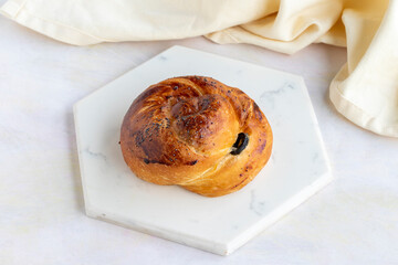 Pastry with olives on a white wooden background. Local name zeytinli açma