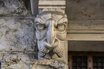 Architectural fragments of a Roman Traditional old house with barrels and sculptures in the old town of the city. Rome, Lazio, Italy, Europe.