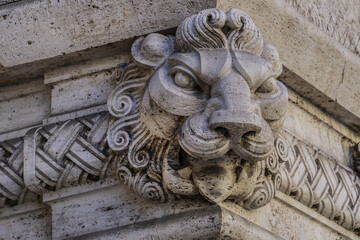 Architectural fragments of a Roman Traditional old house with barrels and sculptures in the old town of the city. Rome, Lazio, Italy, Europe.