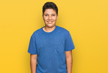 Teenager hispanic boy wearing casual clothes with a happy and cool smile on face. lucky person.