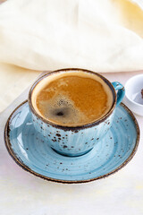 Filter coffee on white wooden background. Local name filtre kahve