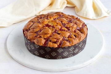 Raspberry cake on a white wooden background