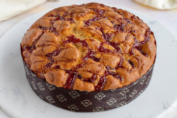 Raspberry cake on a white wooden background
